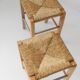 Lot of 2 vintage wooden stools from the 1980s, with hand-woven straw seats.