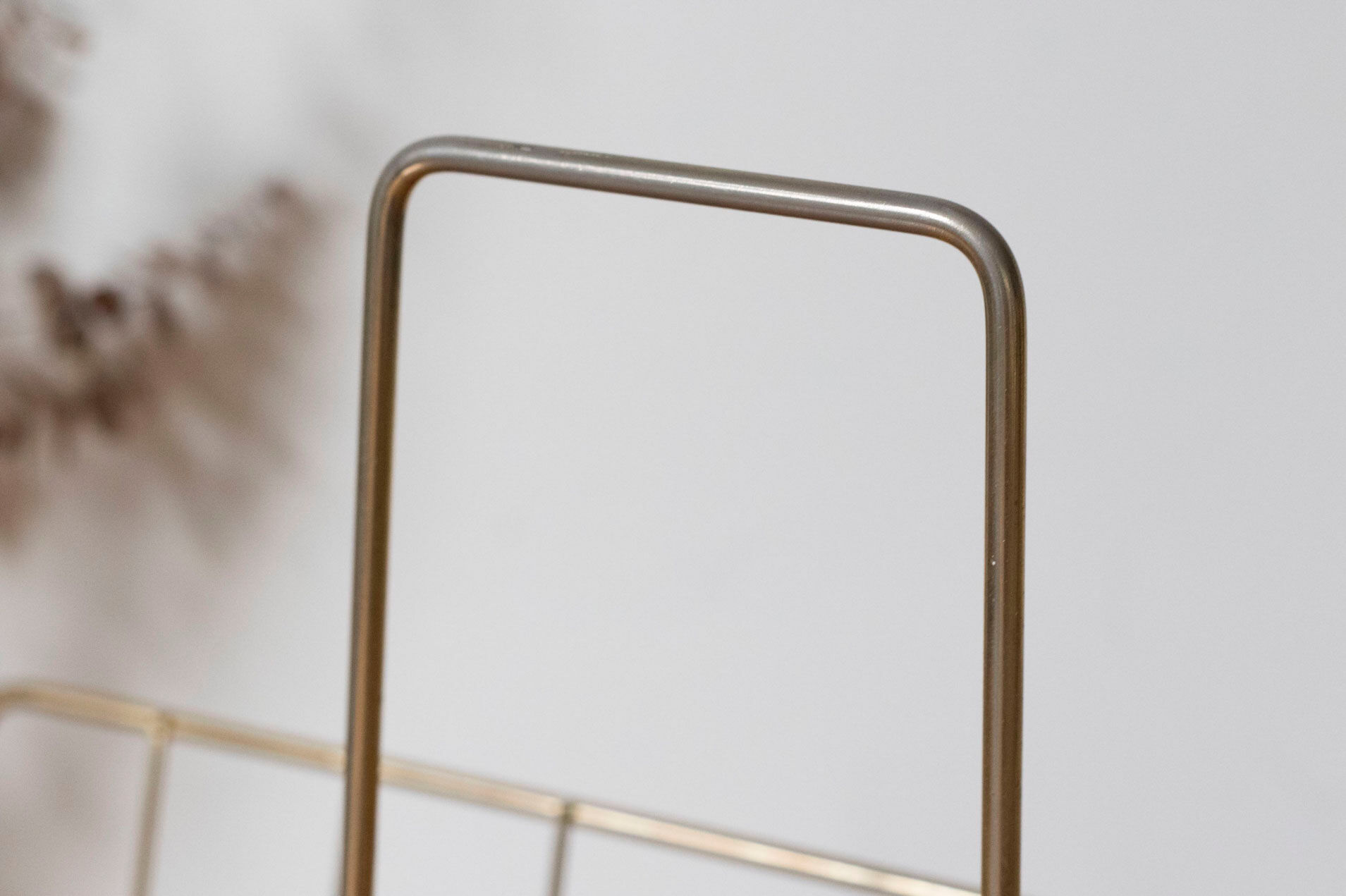 Vintage magazine holder in gold metal