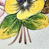 Decorative earthenware and pewter wall plate with spring flowers