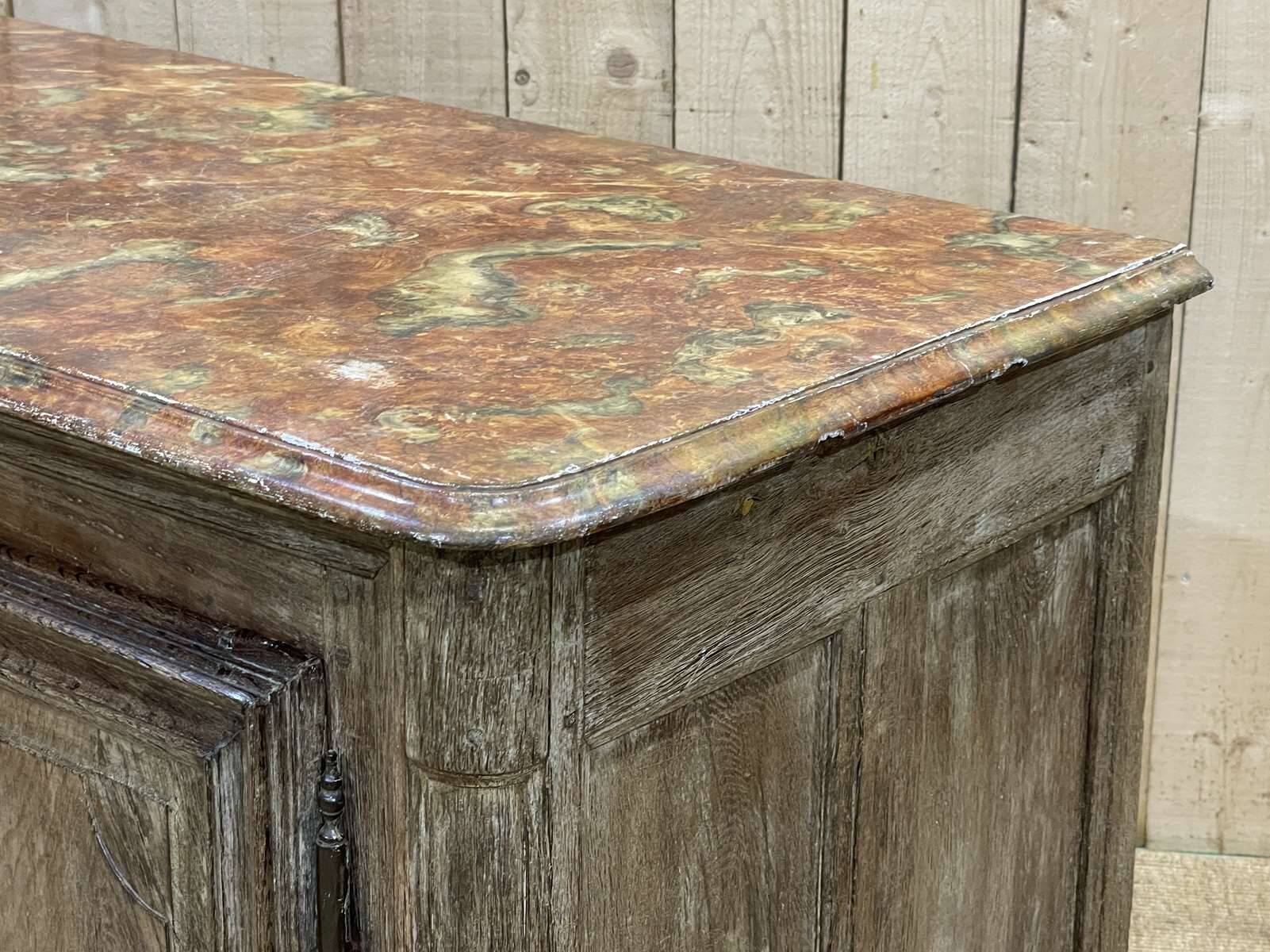 18th-century oak enfilade with a marble-effect painted top.