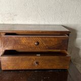 Wooden lady's desk says "happiness of the day"