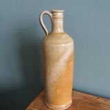 Bottle with handle, pitcher, in stoneware, signed