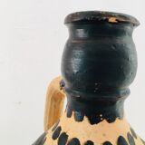 Raw and black terracotta jug