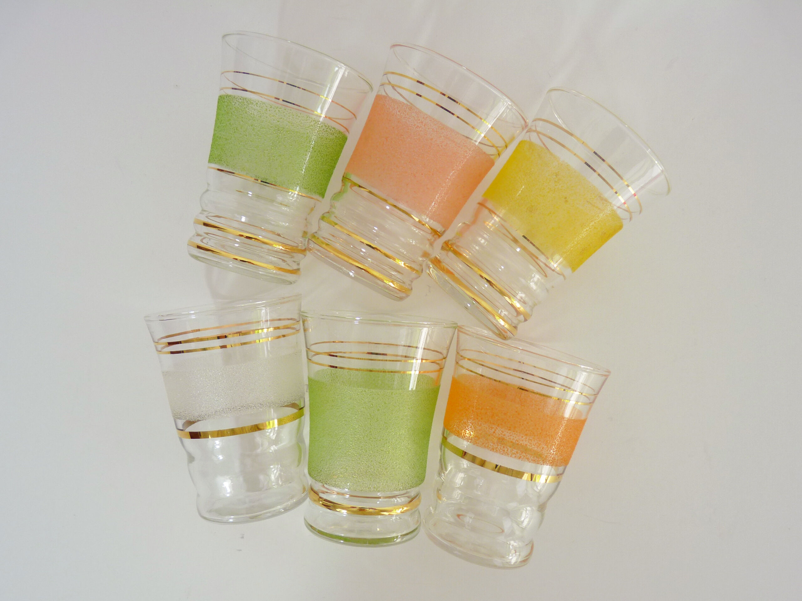 6 old glasses in coloured granite glass and gold lise