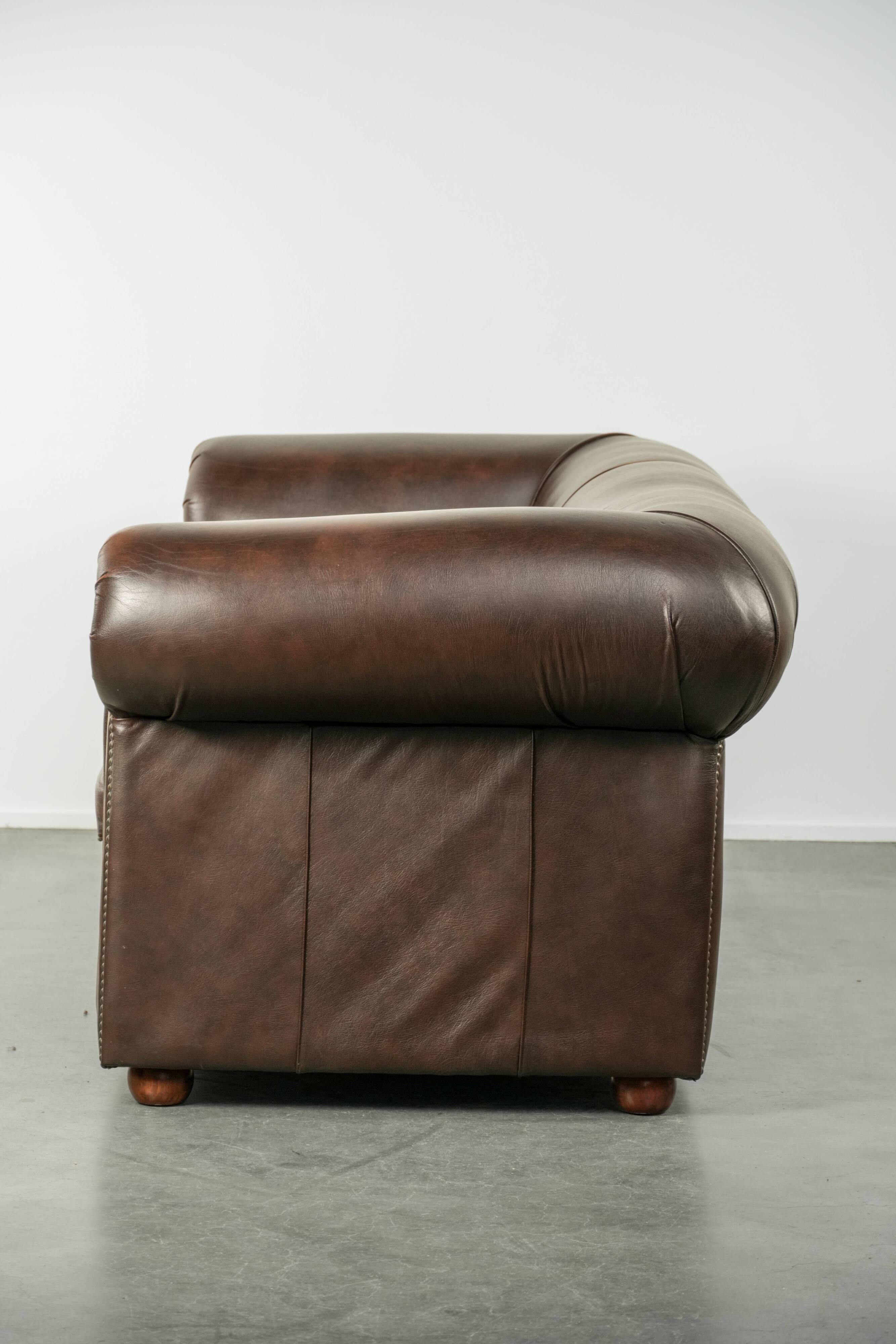 Luxury brown smooth cow leather Chesterfield sofa with an English look