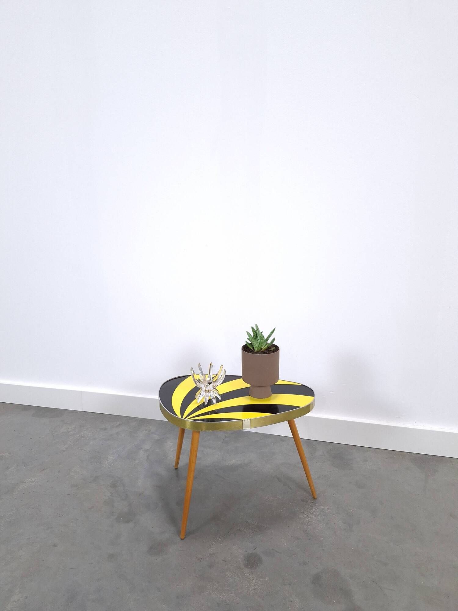 Vintage 1950s black and yellow striped formica table, plant table.