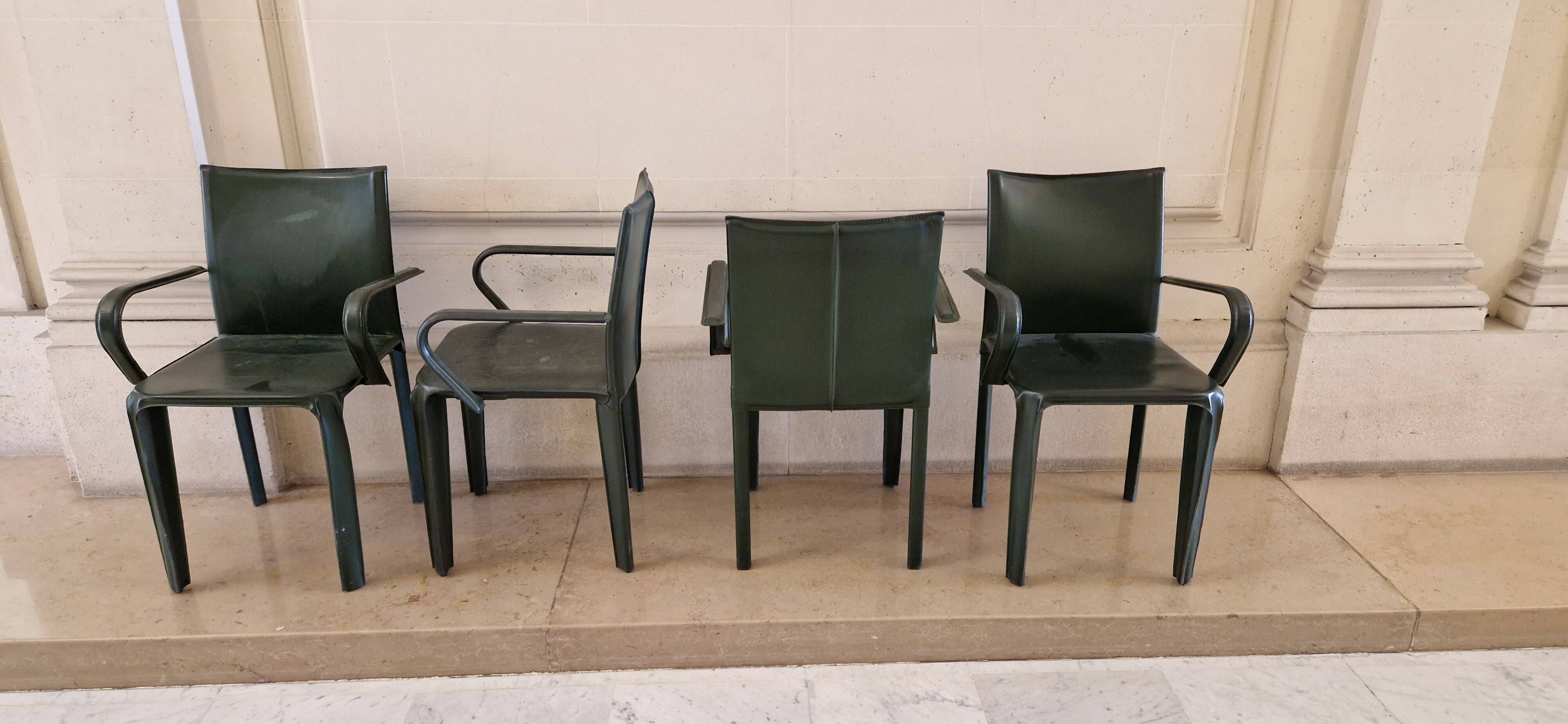 Set of 4 green leather chairs