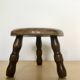 Low tripod stool in solid wood