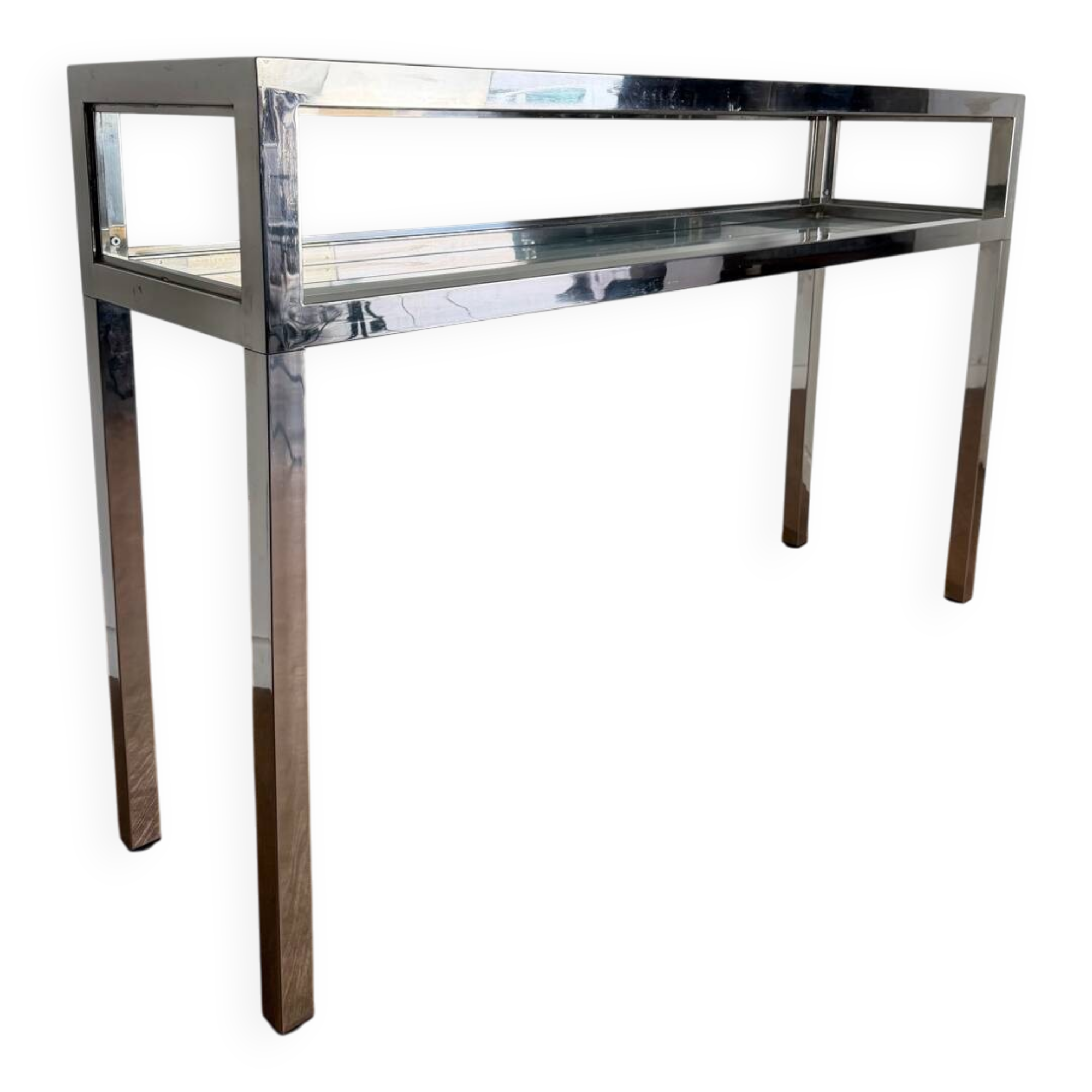 Console with a graphic and architectural design, in chrome metal and glass.