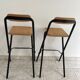 2 foldable bar stools from the 90s in wood and black metal