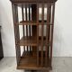 Rotating library in solid walnut, 20th century.