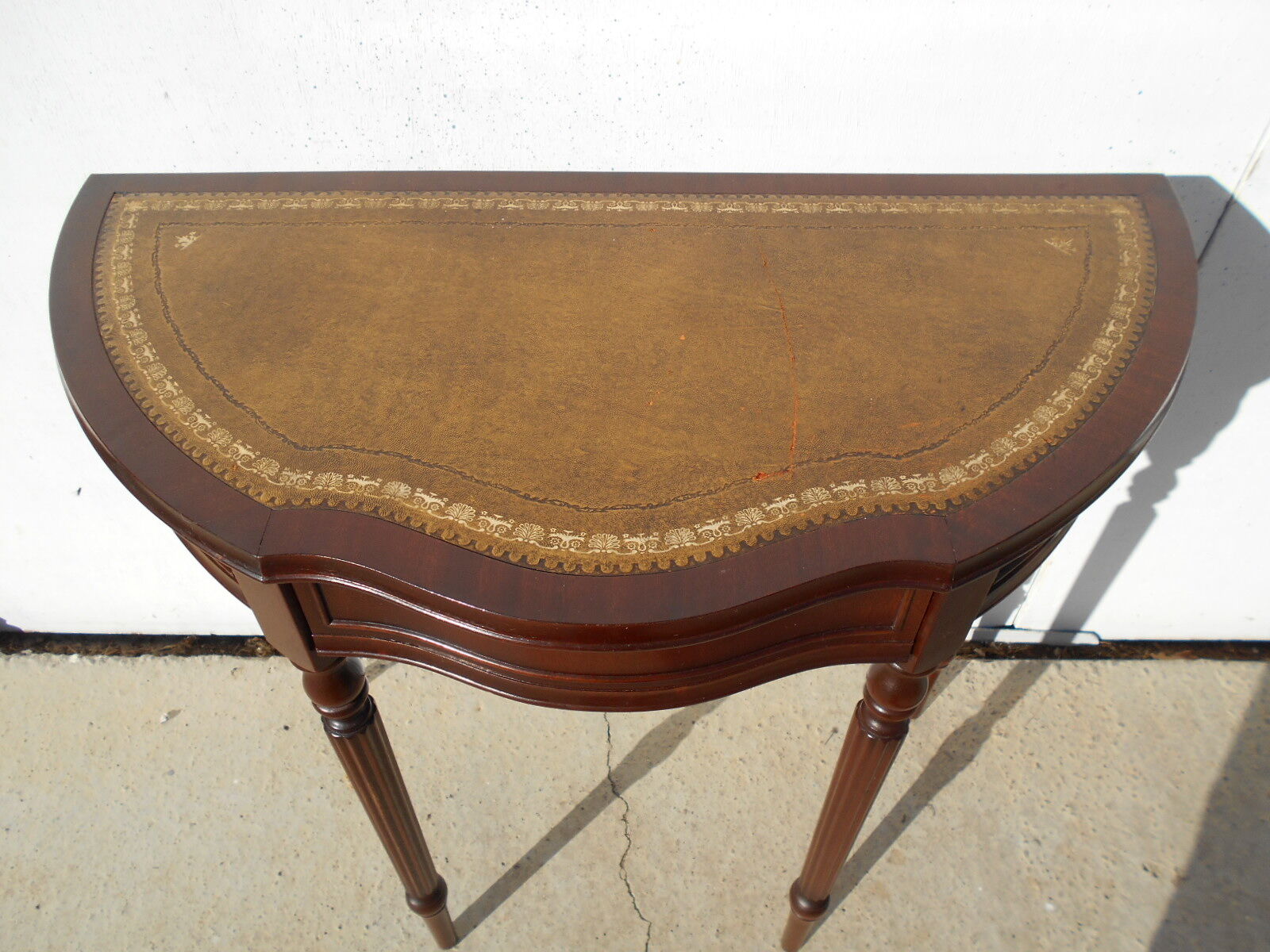 English-style half-moon console, mahogany and leather