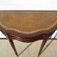English-style half-moon console, mahogany and leather