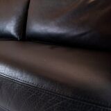 Two seater sofa upholstered with black leather and of danish design