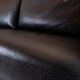 Two seater sofa upholstered with black leather and of danish design