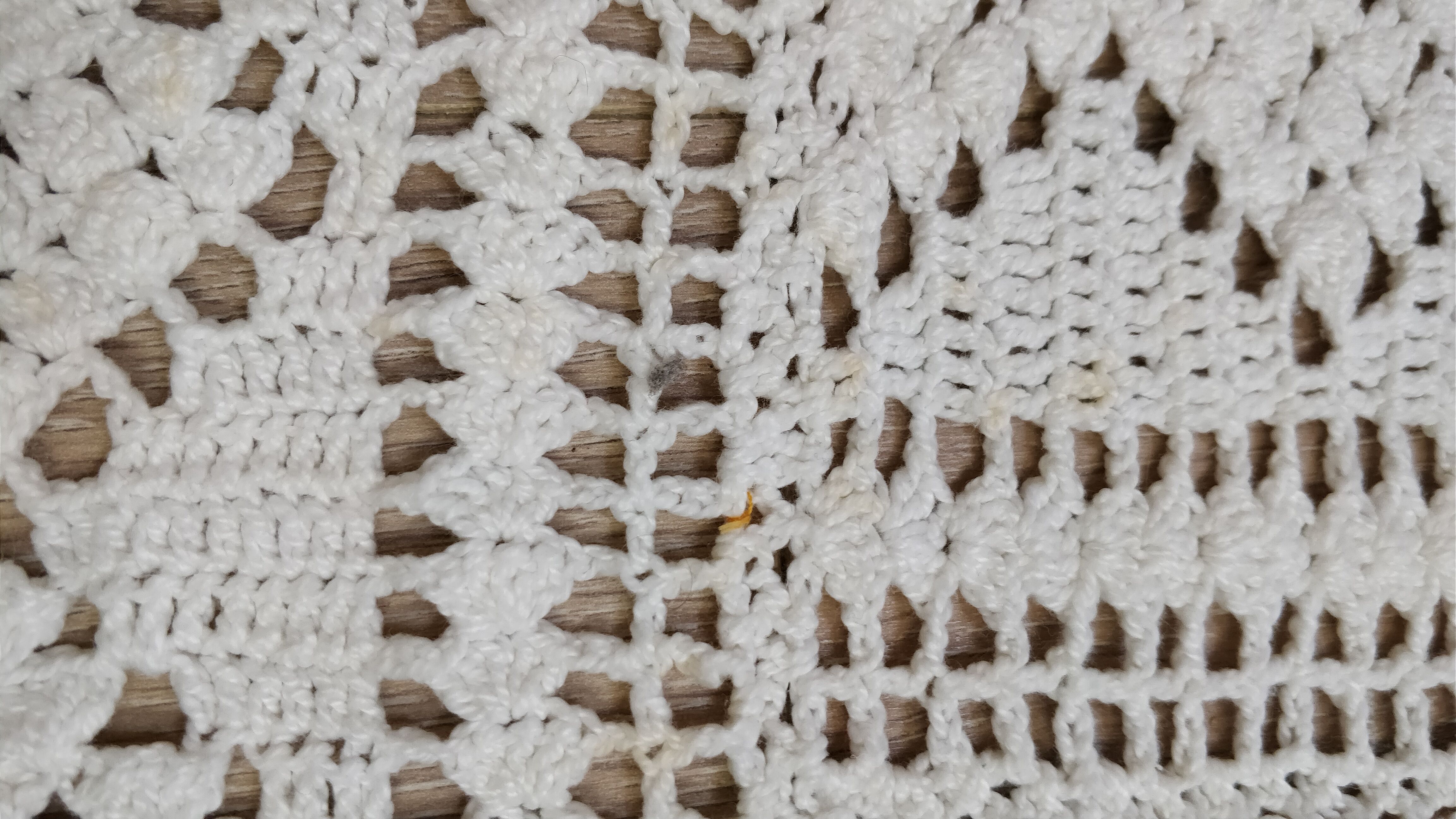 White two-seater crocheted bed top