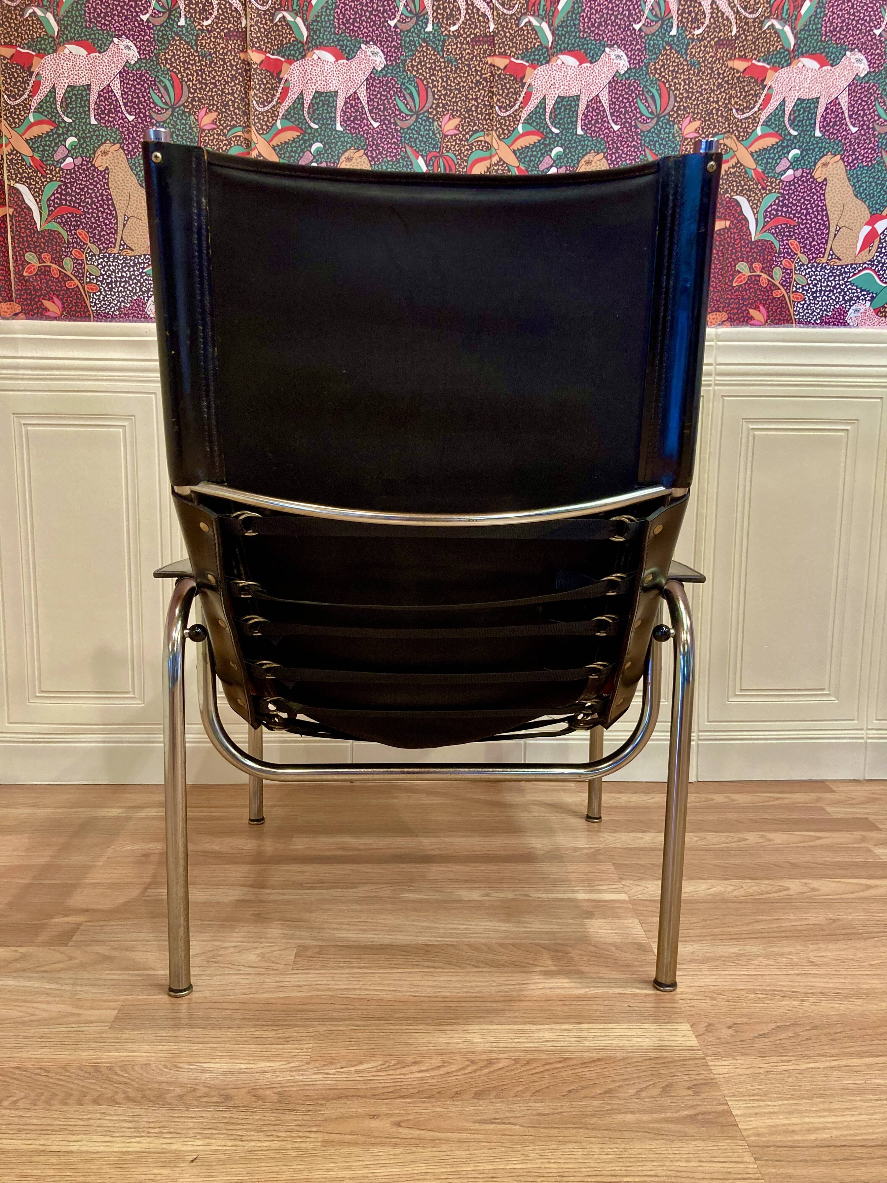 Reclining armchair in black leather and chrome design "hans eichenberger" 1960.