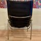 Reclining armchair in black leather and chrome design "hans eichenberger" 1960.