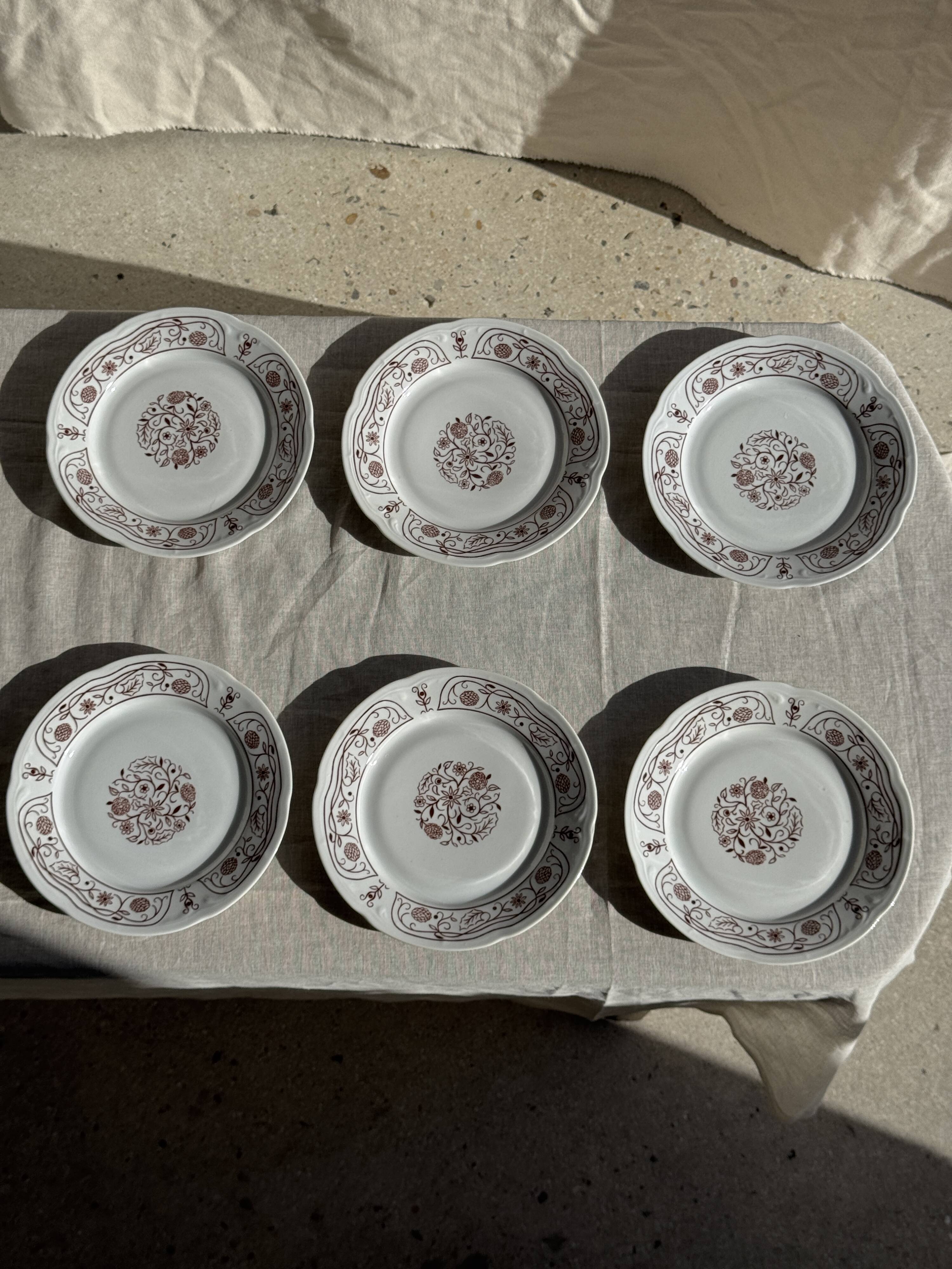 Set of 6 vintage dessert plates made in Poland with a plant motif.