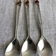 Art Nouveau metal and amber spoons