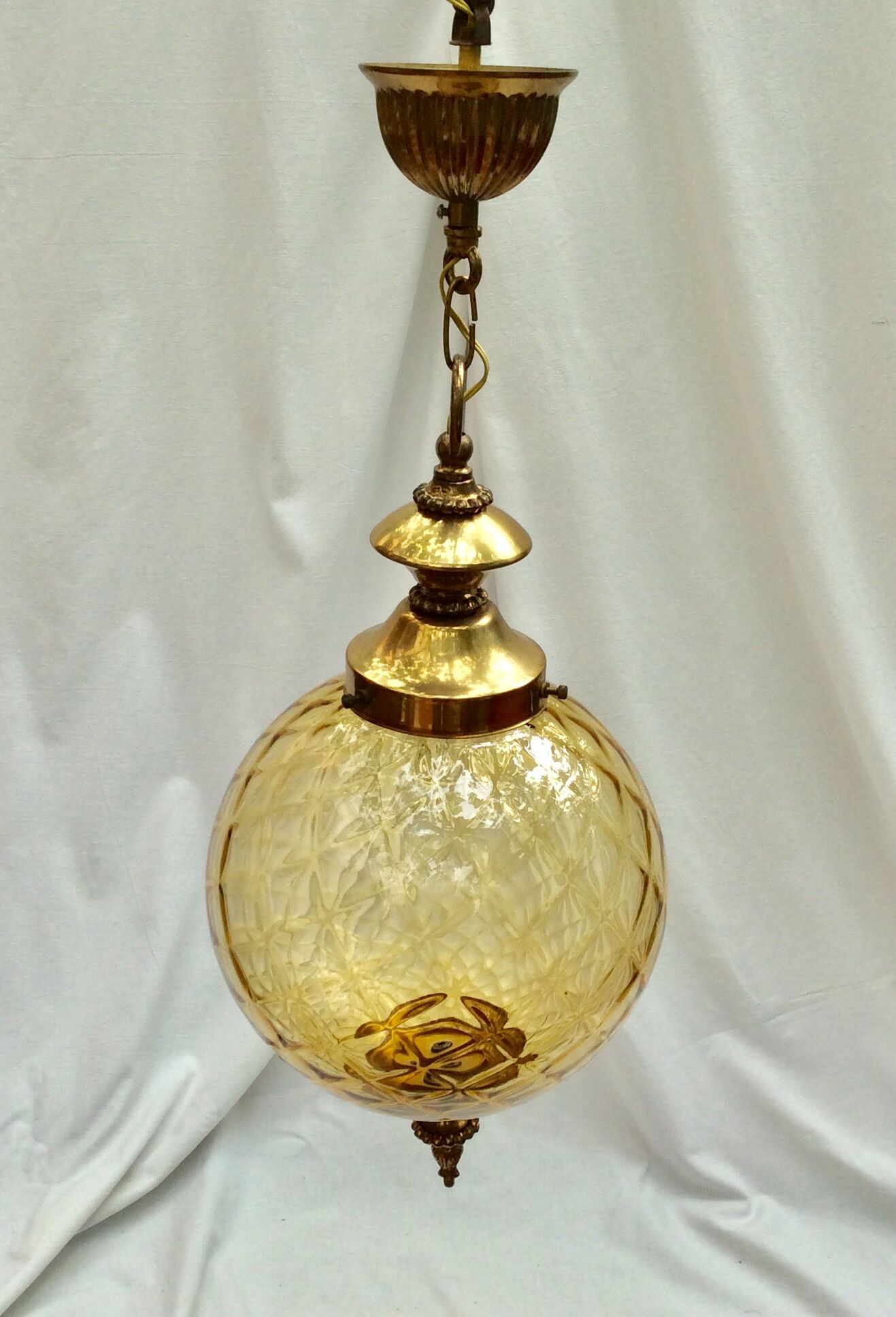 Amber glass suspension with brass