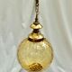 Amber glass suspension with brass