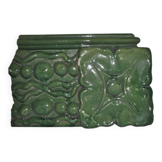 Green enamelled ceramic stove tile — finely sculpted Hungarian pattern from the late 19th century.