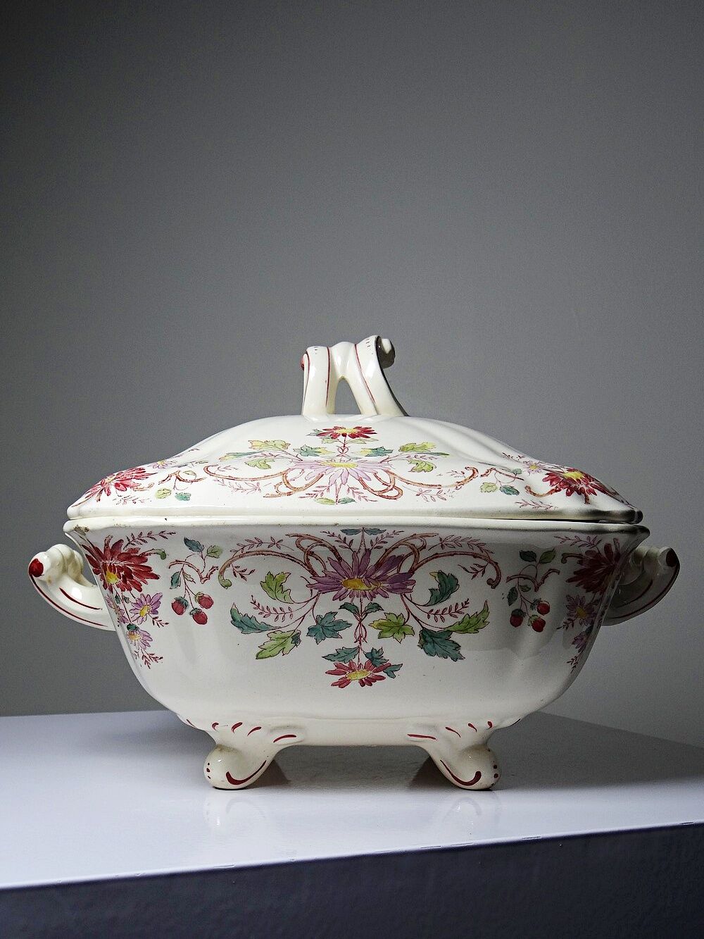 Antique Longchamp soup tureen/vegetable dish with polychrome daisies in ironstone.