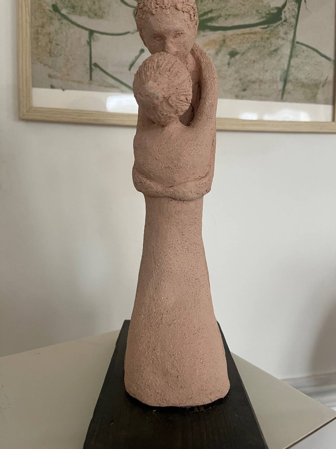 Sculpture of a couple entwined in grog clay.