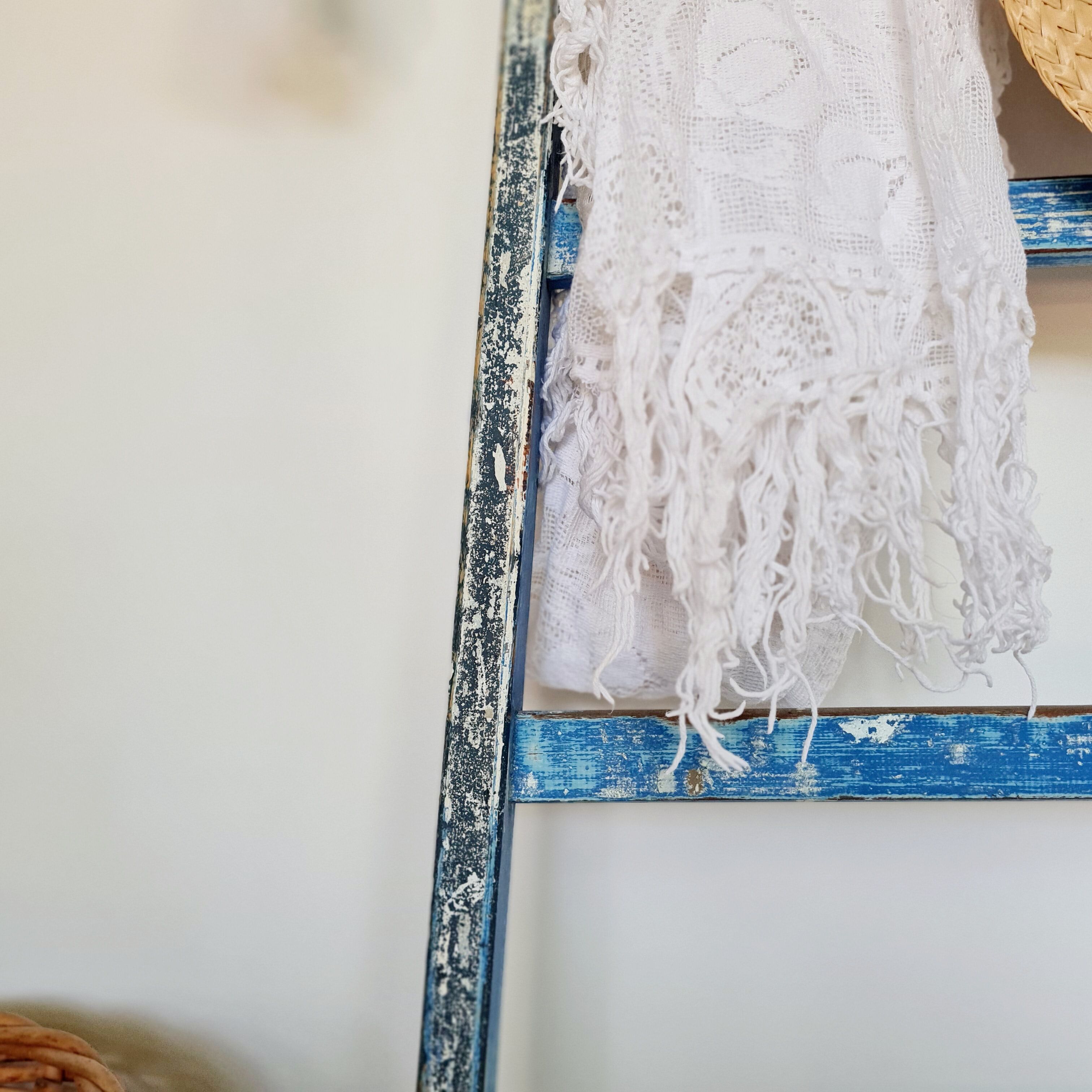 Old ladder in blue wood