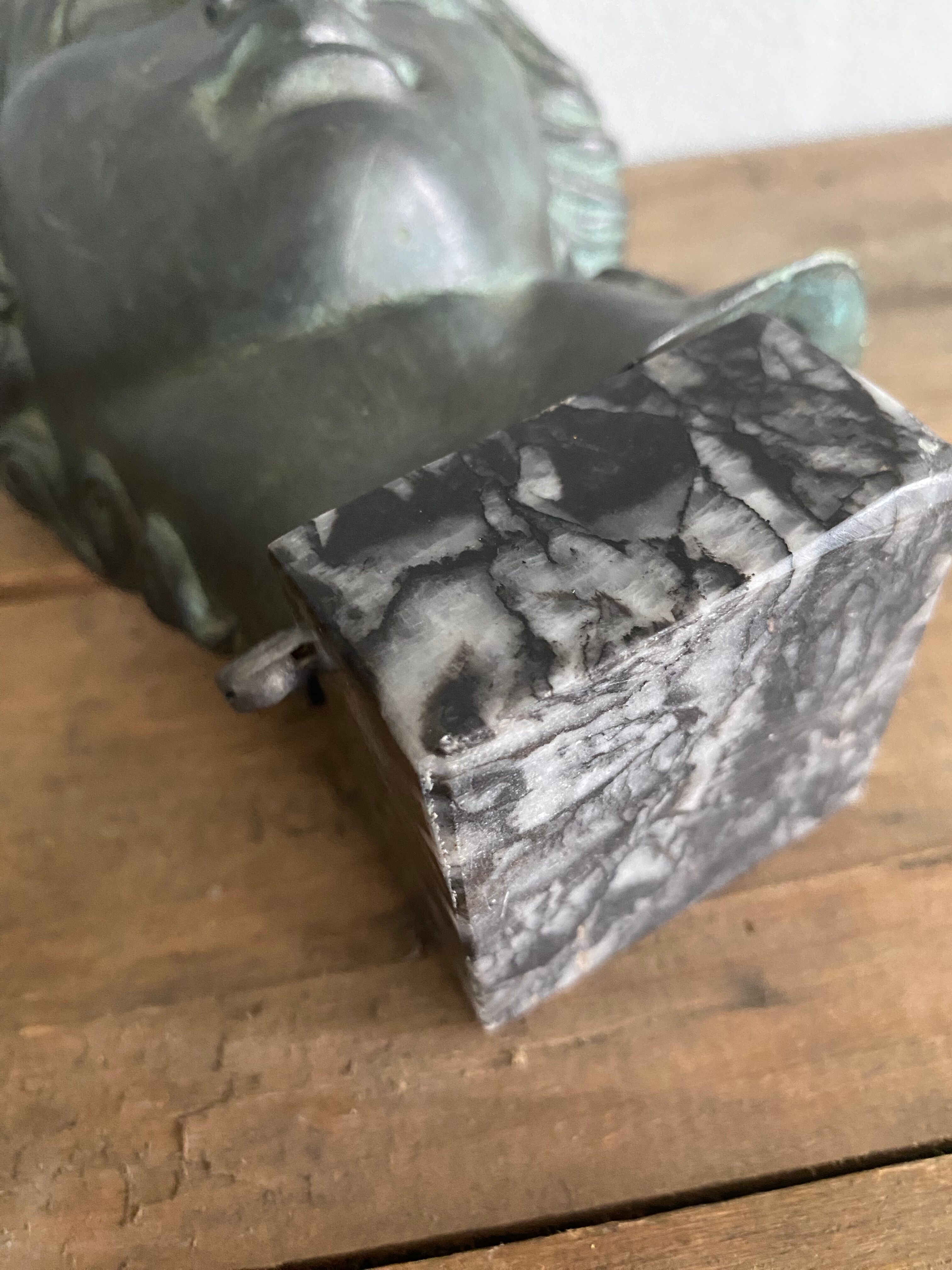 Greek head in patinated plaster with marble base