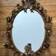 Miroir ovale en métal doré