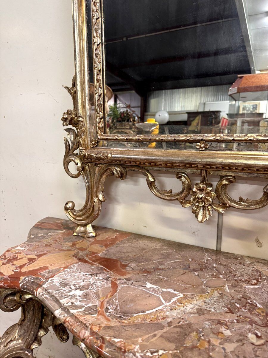 Important console table with a curved shape + Louis XV style mirror in gilded and silvered wood.