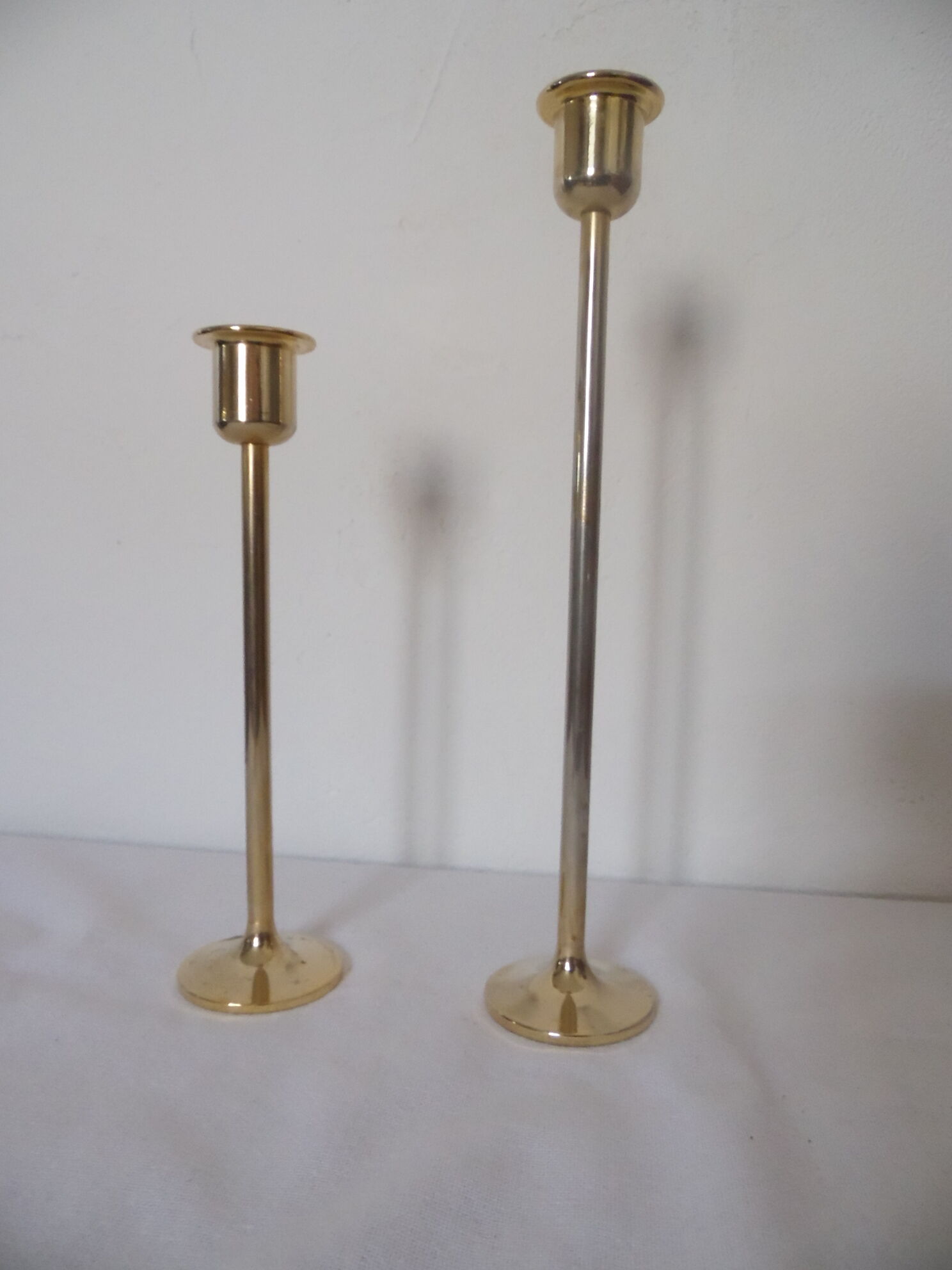 Duo of minimalist gold-plated candle holders