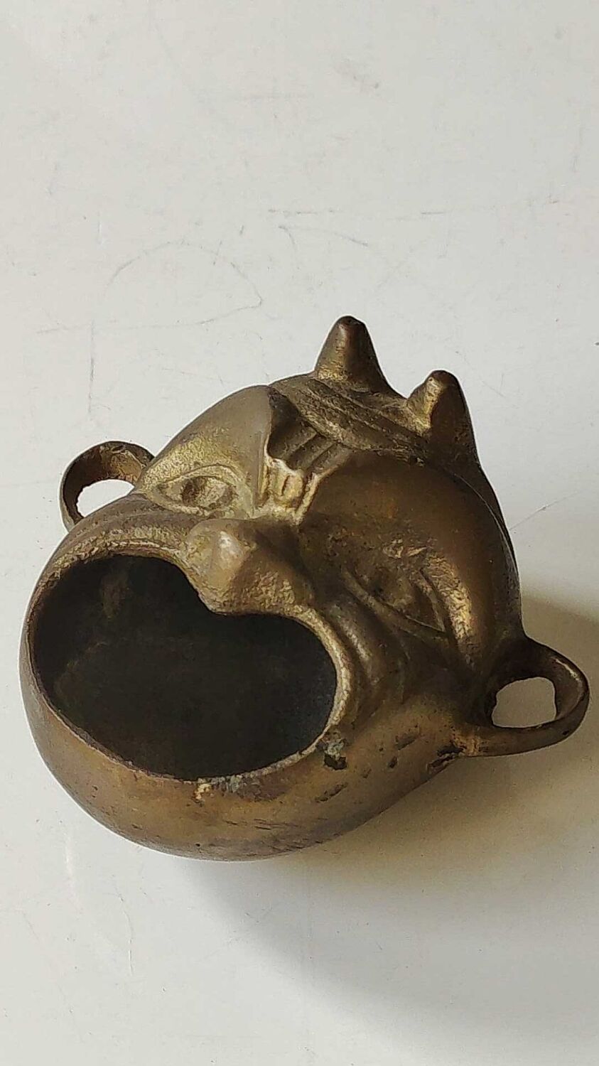 Ashtray/empty pocket devil's satyric head/diablotin, in bronze with golden patina. signed medina iran