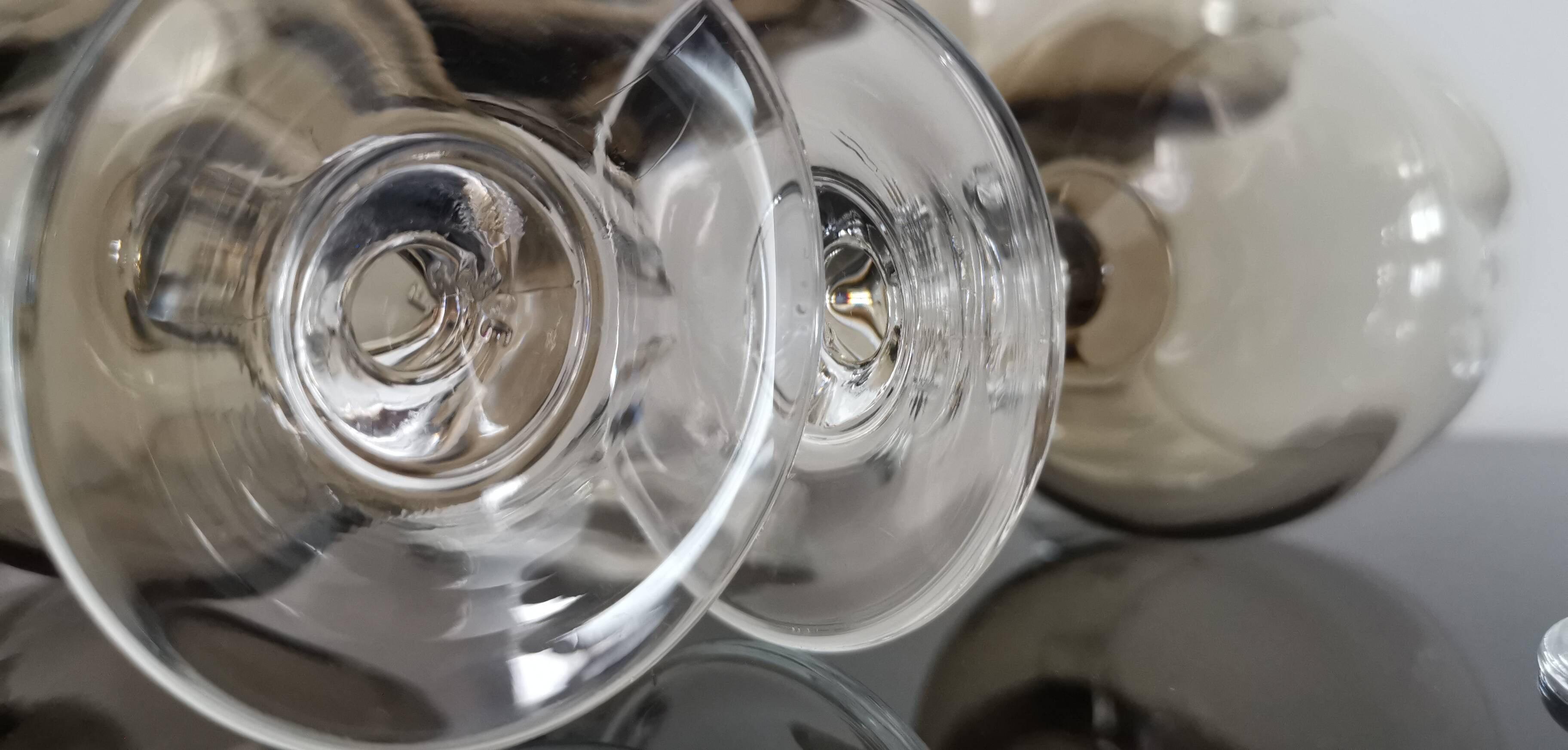 9 white wine glasses on vintage Luminarc smoked black stem