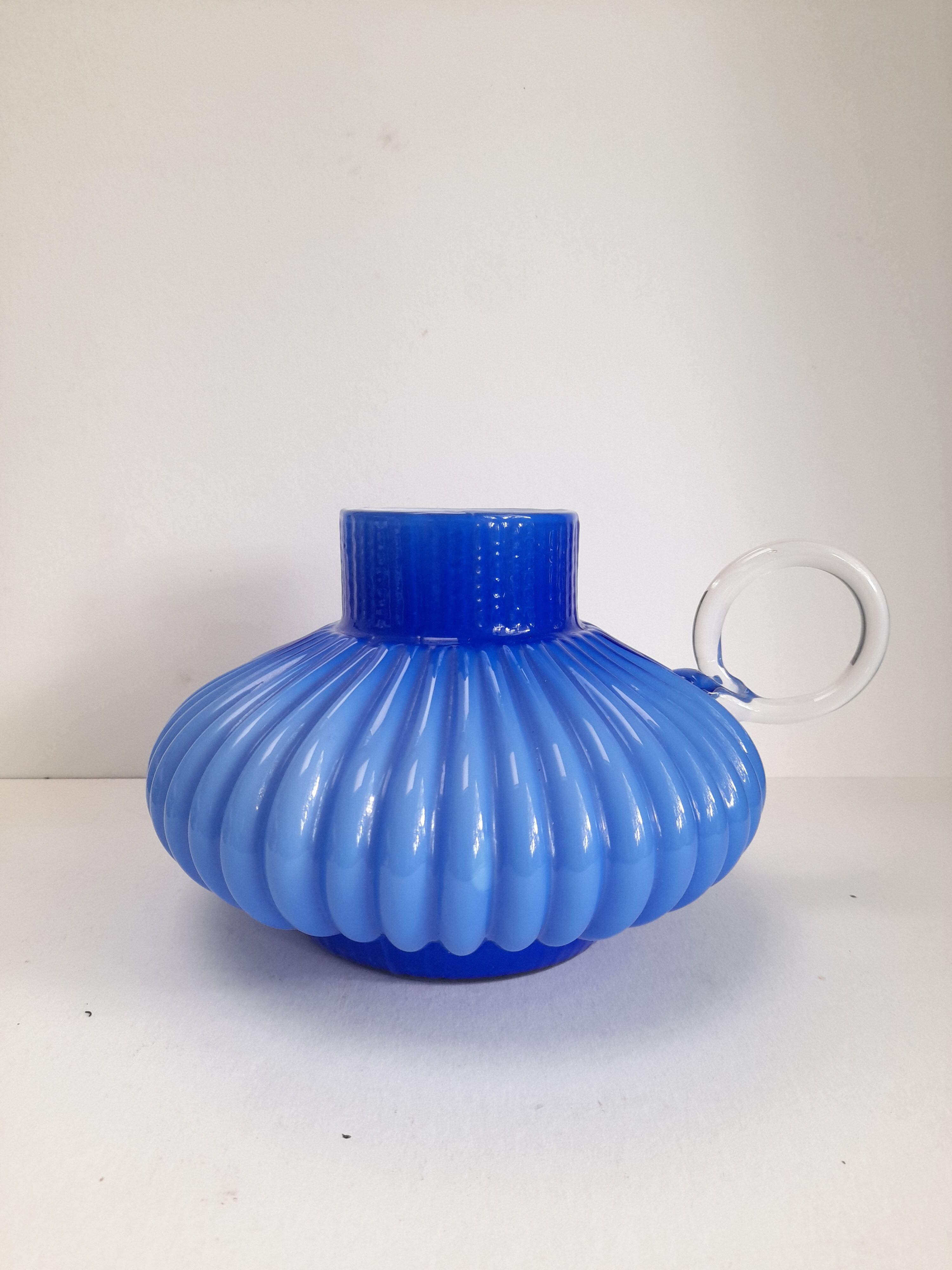 Blue opaline vase with a round handle