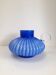 Blue opaline vase with a round handle