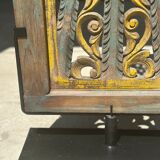 Rectangular Indonesian construction element with blue and yellow plant in carved wood