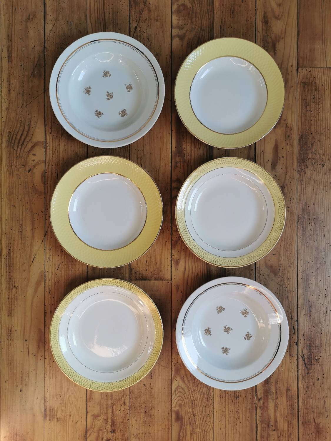 Vintage mismatched yellow and gold soup plates