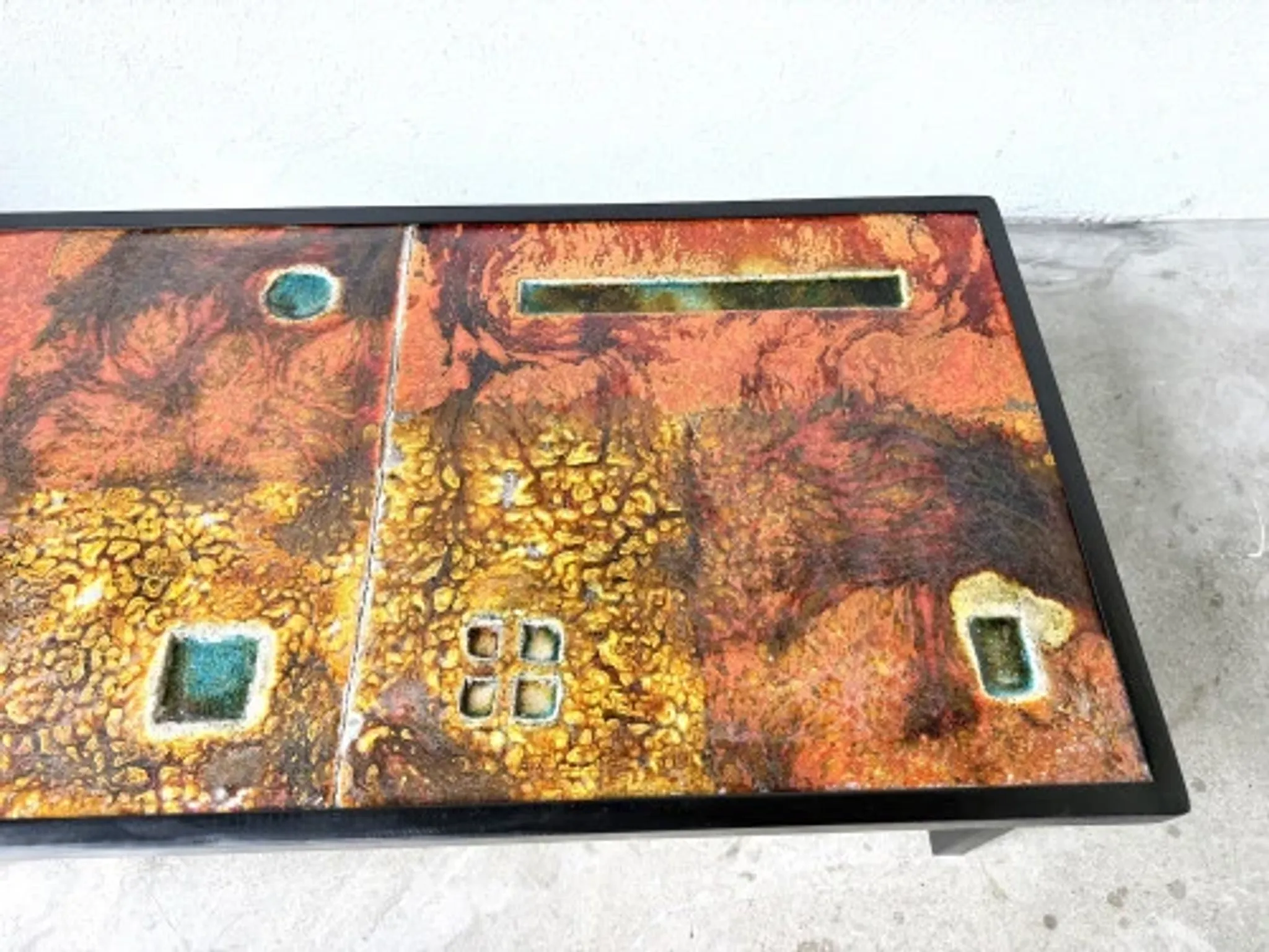 Coffee table by Robert and Jean Cloutier in enamelled lava and metal, 1950s.