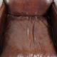 Dark cognac-coloured set of 2 sheepskin armchairs with a sleek design