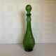 Green carafe bottle with apple, pear, and grape pattern from Italy.