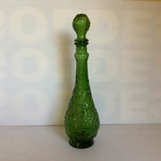 Green carafe bottle with apple, pear, and grape pattern from Italy.