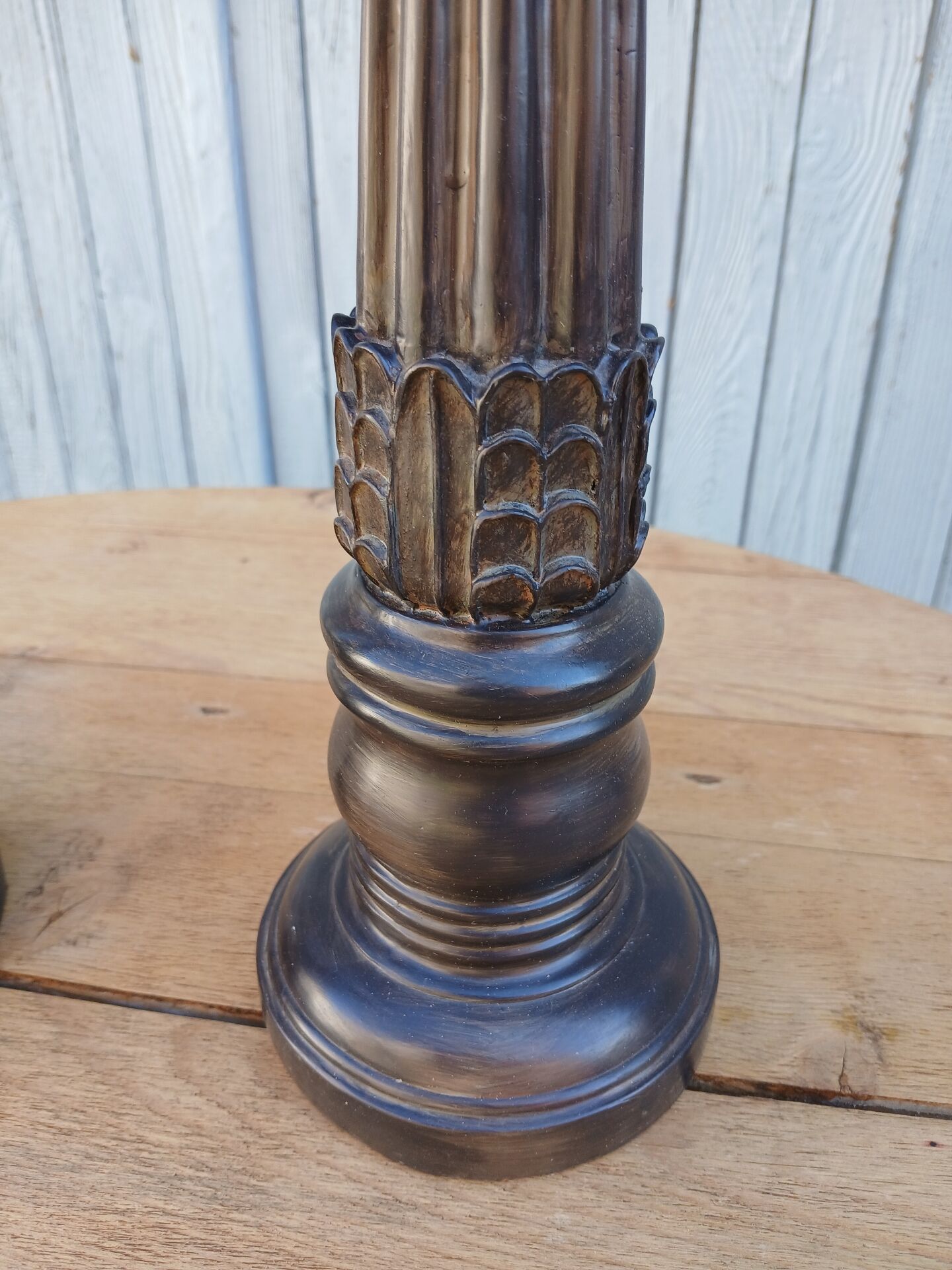2 carved wooden candlesticks