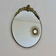 Oval mirror in gilded brass with frieze 40s 50s, 37x50 cm