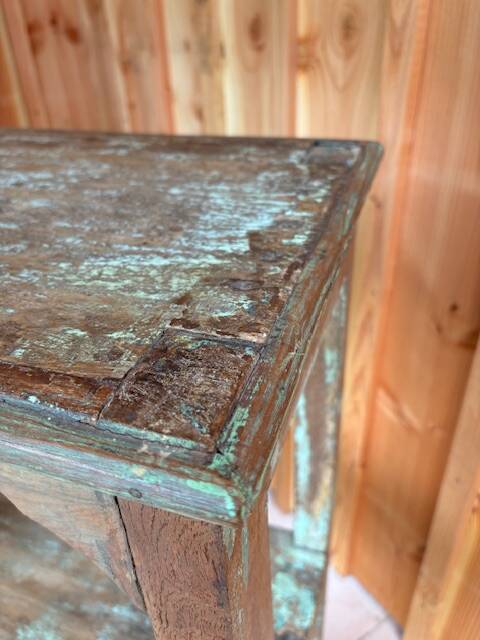 Teak shelves with a green patina