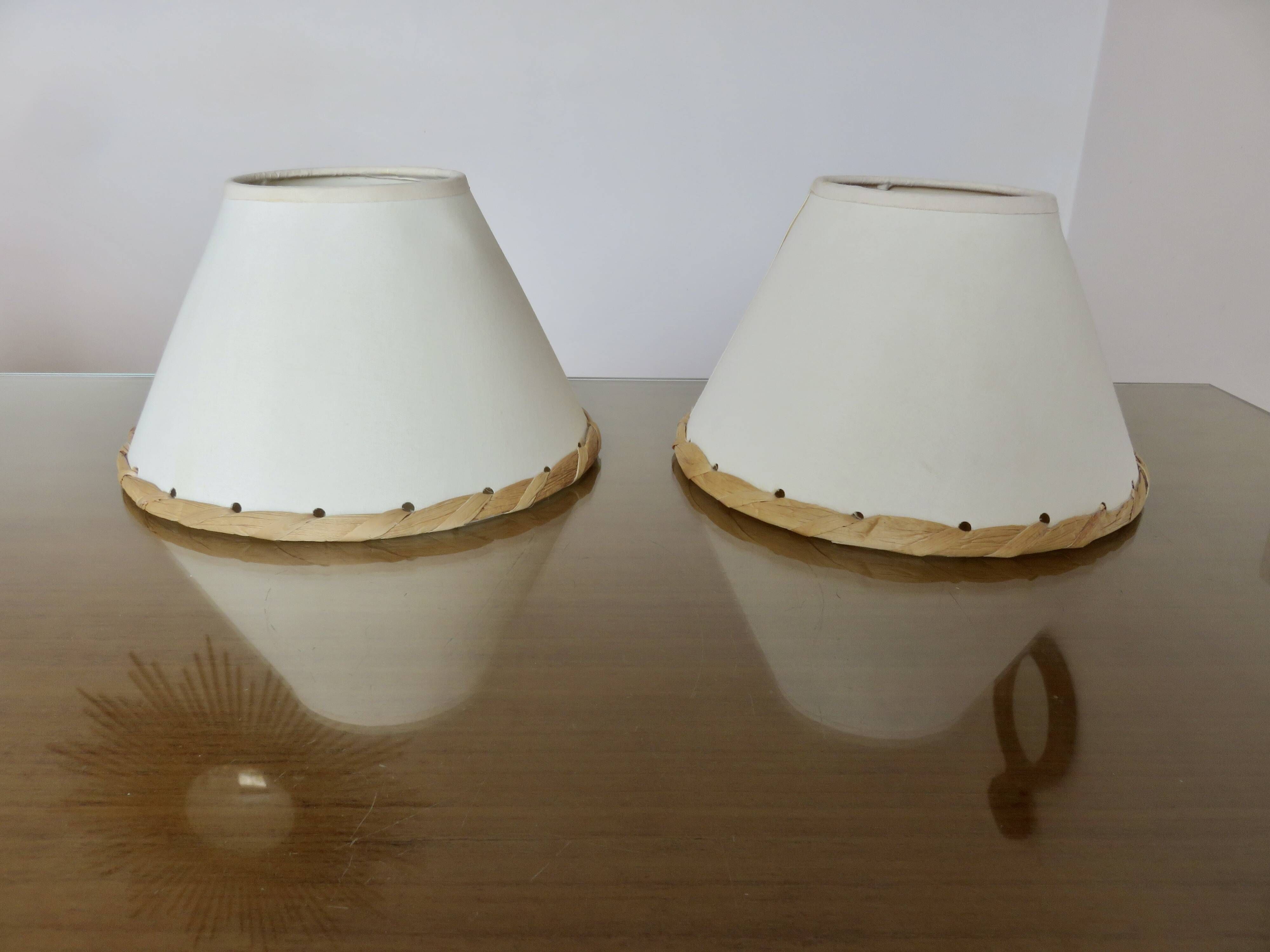 Pair of bedside lamps made of woven sea rush, matching lampshades, 1980.
