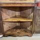 19th-century English corner cabinet in oak, mahogany, and fir.