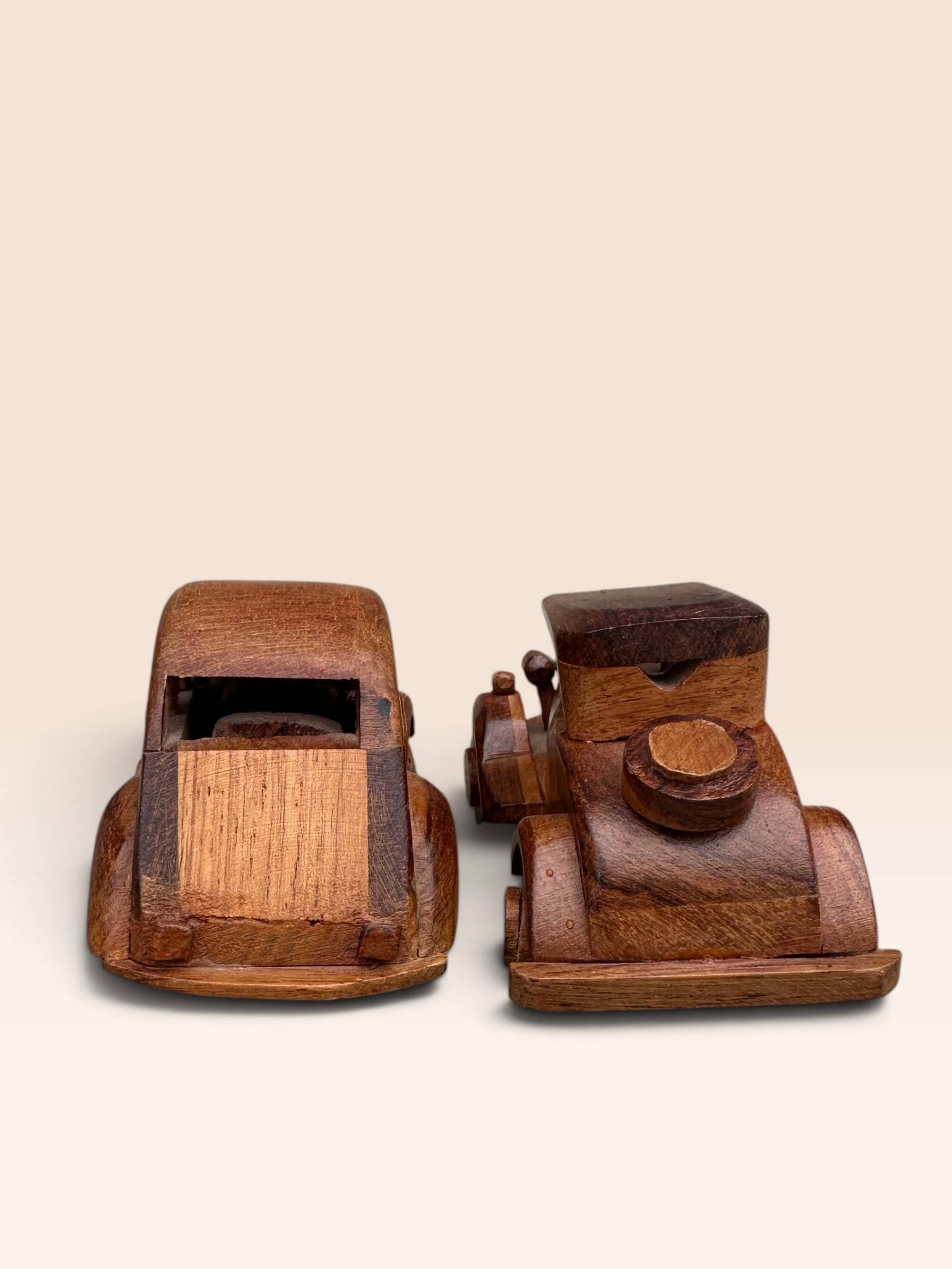 Pair of small handcrafted wooden cars